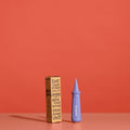 Chompshop Hole Punch tool and packaging on a red background.