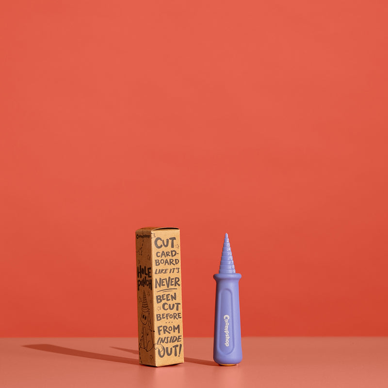 Chompshop Hole Punch tool and packaging on a red background.