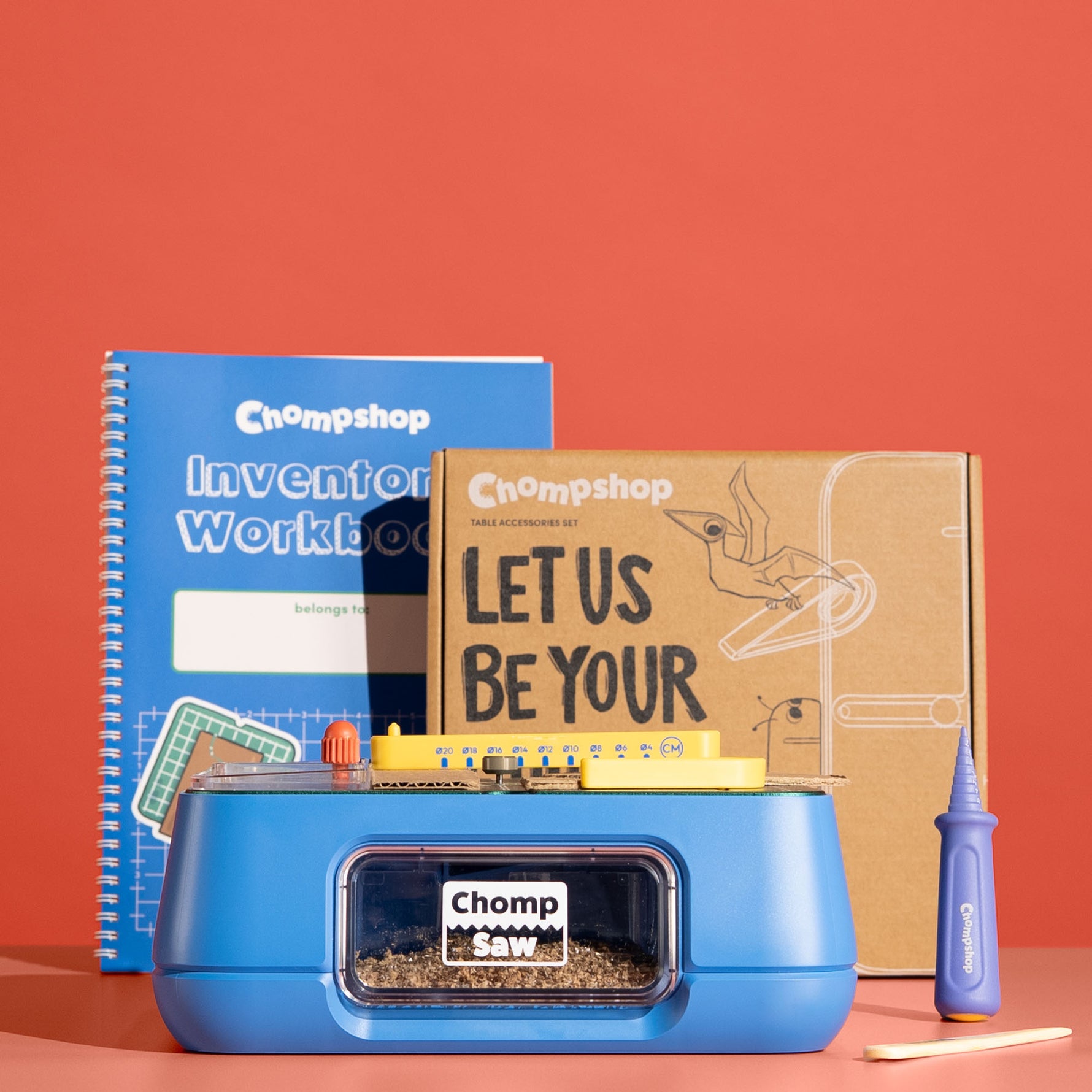 Chompshop Maker Bundle including the ChompSaw, Inventor's Workbook, Table Accessories Set, Hole Punch, and Scoring Tool